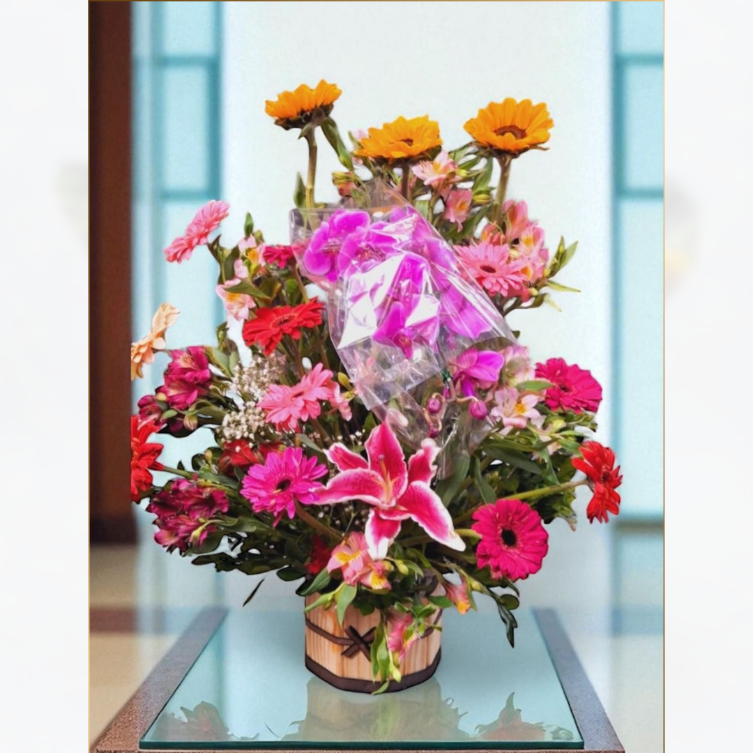 ARRANJO DE ORQUÍDEA COM
GIRASSOL LÍRIOS E GÉRBERAS